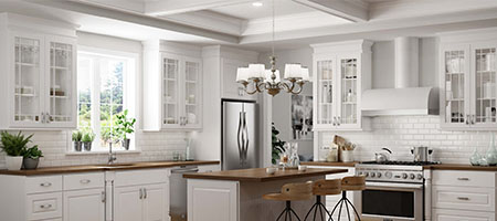 Kitchen with white wooden cabinets